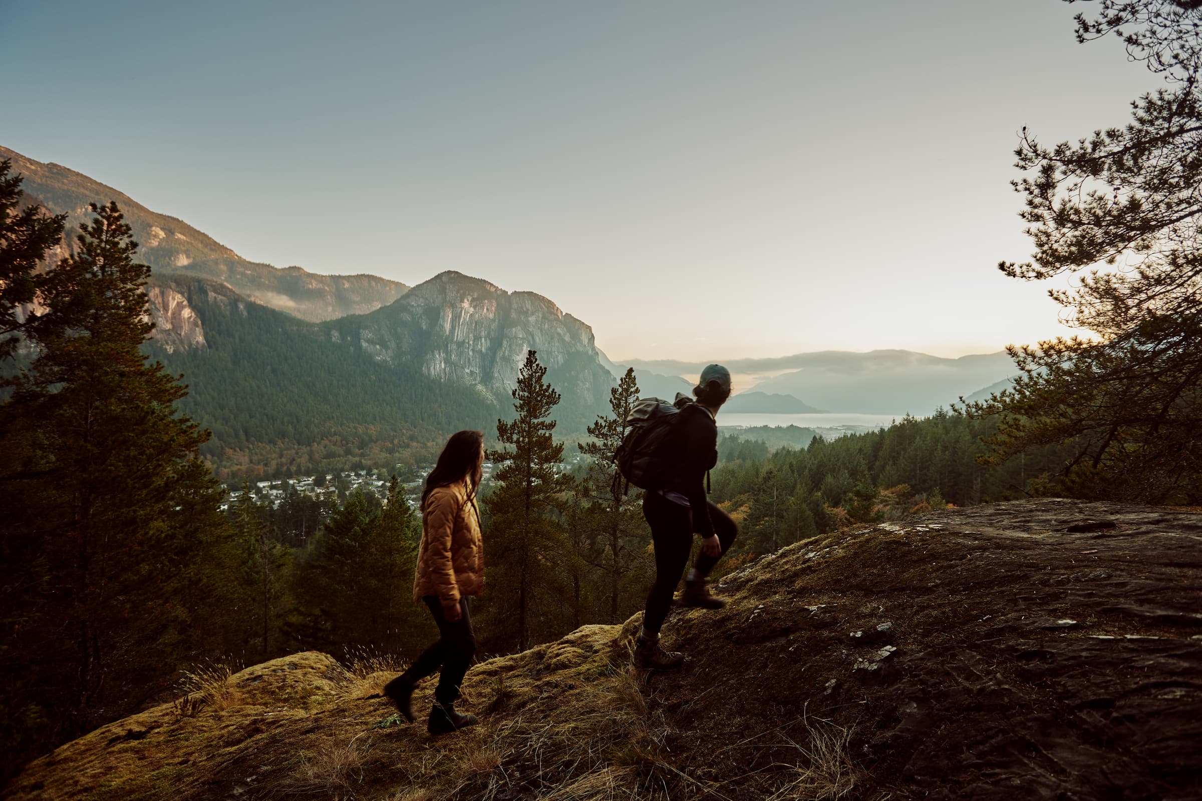 Homepage header depicting a people hiking in the woods
